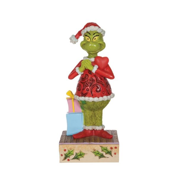 Figurine du Grinch heureux avec un cœur clignotant